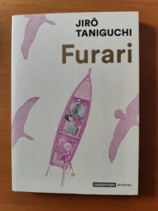 Cover von Jirō Taniguchis "Der Kartograph". Ein Mann und eine Frau sitzen in einem Boot und schauen nach oben.